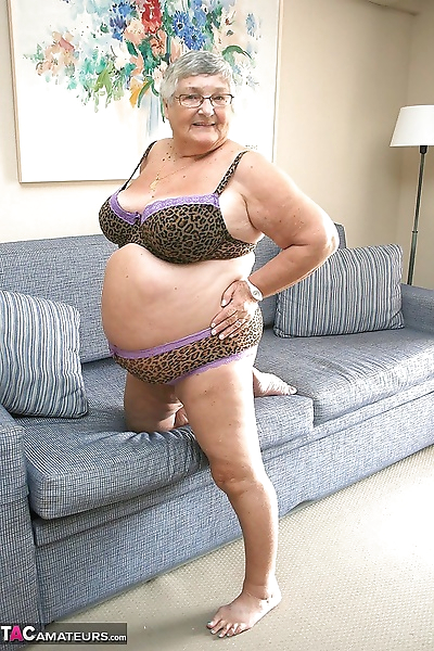 Huge fatty granny baring her..